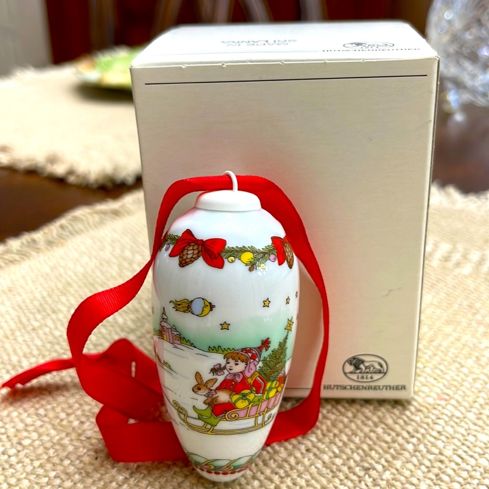 Hutschenreuther Christmas ornament, girl with rabbit on sleigh.